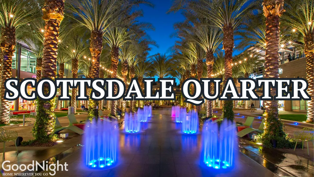 A festive nighttime scene filled with colorful water fountains, palm trees, and modern architecture. The area is well-lit and inviting, ideal for evening strolls, socializing, and dining out, highlighting the lively nightlife and entertainment options nearby.